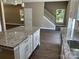 Kitchen island overlooking staircase and open floor plan with hardwood floors at 183 Pine Haven Rd, Statesville, NC 28677