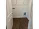 Well-lit laundry room with wood-look floors and ample storage space at 183 Pine Haven Rd, Statesville, NC 28677