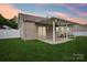 Enjoy the outdoors on this home's covered patio and well-maintained backyard at 2021 Chantilly Ln, Salisbury, NC 28146