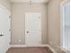 Empty bedroom includes neutral paint and carpet plus two closets at 2021 Chantilly Ln, Salisbury, NC 28146