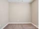 Empty, beige bedroom showcasing carpet, neutral walls, and ceiling fan at 2021 Chantilly Ln, Salisbury, NC 28146
