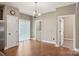 Bright dining room features hardwood floors and contemporary chandelier lighting at 2021 Chantilly Ln, Salisbury, NC 28146
