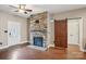 Inviting living room with stone fireplace, wood floors, and sliding barn door at 2021 Chantilly Ln, Salisbury, NC 28146