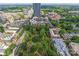 Stunning aerial shot of the cityscape featuring lush greenery and vibrant urban development at 210 N Church St # 2910, Charlotte, NC 28202