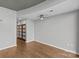 Neutral bedroom features wood floors, a ceiling fan, and a double-door closet at 210 N Church St # 2910, Charlotte, NC 28202