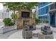 Outdoor fireplace with seating area and city views at 210 N Church St # 2910, Charlotte, NC 28202