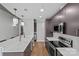 Modern kitchen features stainless steel appliances, granite countertops, and bar seating at the island at 210 N Church St # 2910, Charlotte, NC 28202