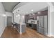 Modern kitchen featuring stainless steel appliances, granite countertops, and bar seating at the island at 210 N Church St # 2910, Charlotte, NC 28202