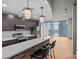 Contemporary kitchen features modern appliances, a stylish brick island with bar stools, and an open floor plan at 210 N Church St # 2910, Charlotte, NC 28202