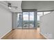Spacious living room with balcony access and stunning panoramic city views at 210 N Church St # 2910, Charlotte, NC 28202