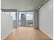 Bright living room features floor-to-ceiling windows with expansive cityscape views at 210 N Church St # 2910, Charlotte, NC 28202