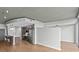 Open-concept living space with modern kitchen, island seating, and hardwood floors at 210 N Church St # 2910, Charlotte, NC 28202