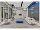 Spacious lobby featuring a plush gray sofa, modern decor, and a decorative water feature on the wall at 210 N Church St # 2910, Charlotte, NC 28202