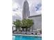 Outdoor pool with lounge chairs and skyscraper views at 210 N Church St # 2910, Charlotte, NC 28202