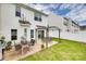 A charming backyard featuring a patio, pergola, outdoor dining area, and well-maintained lawn at 2169 Shady Pond Dr, Clover, SC 29710