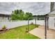 Landscaped backyard features a privacy fence and a pergola-covered patio, creating a serene outdoor space at 2169 Shady Pond Dr, Clover, SC 29710