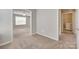 Bedroom featuring neutral carpet and a view into an adjoining laundry room and main bedroom at 2169 Shady Pond Dr, Clover, SC 29710