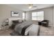 Well-lit bedroom with neutral walls, sitting area, stylish decor and modern furnishings at 2169 Shady Pond Dr, Clover, SC 29710