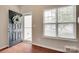 Bright entryway featuring an open door, welcome wreath, and window with blinds at 2169 Shady Pond Dr, Clover, SC 29710