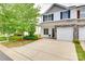 View of townhome with tidy landscaping, hardscaped driveway, and classic curb appeal at 2169 Shady Pond Dr, Clover, SC 29710