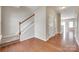 Welcoming foyer featuring hardwood flooring, a staircase with white banister, and natural light at 2169 Shady Pond Dr, Clover, SC 29710