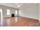 Cozy living room with hardwood floors, a fireplace, and large windows at 2169 Shady Pond Dr, Clover, SC 29710
