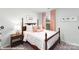 Cozy bedroom with four-poster bed, pink curtains and light walls provides a relaxing space at 221 Paige Rd, Kings Mountain, NC 28086