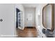 Clean and inviting foyer with hardwood floors, decorative mirror, an entry table, and a glass paneled front door at 221 Paige Rd, Kings Mountain, NC 28086