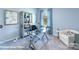 Well-appointed home office with a glass desk, decor and a comfortable seating area at 221 Paige Rd, Kings Mountain, NC 28086