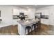 Well-lit kitchen features an island with granite countertops, modern appliances, and white cabinetry at 221 Paige Rd, Kings Mountain, NC 28086