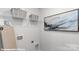 Bright laundry room with shelving and utility connections at 221 Paige Rd, Kings Mountain, NC 28086