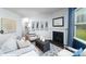 Living room with decor, fireplace, and large windows at 221 Paige Rd, Kings Mountain, NC 28086