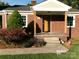 Detailed front of a brick home with a covered porch and updated siding at 2357 28Th Ne St, Hickory, NC 28601