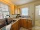 This is a kitchen that features neutral-colored cabinets, stainless steel sink, and natural light at 2357 28Th Ne St, Hickory, NC 28601