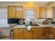 Functional kitchen space with oak cabinets, double sink and natural light at 2357 28Th Ne St, Hickory, NC 28601