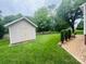 The backyard features a shed, mature trees, and green grass at 2357 28Th Ne St, Hickory, NC 28601