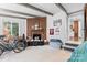 Spacious basement with brick fireplace and access to kitchen at 2536 Bancroft St, Charlotte, NC 28206