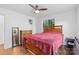 Bedroom with hardwood floors, ceiling fan, and view to the outside at 2536 Bancroft St, Charlotte, NC 28206