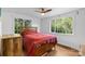 Cozy bedroom featuring hardwood floors, a ceiling fan, and natural light at 2536 Bancroft St, Charlotte, NC 28206
