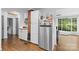 Bright kitchen with stainless steel refrigerator and view into the living room at 2536 Bancroft St, Charlotte, NC 28206