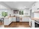 Modern kitchen with white cabinetry, butcher block countertops, and stainless steel appliances at 2536 Bancroft St, Charlotte, NC 28206