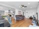 Spacious living area with hardwood floors seamlessly connecting to the modern kitchen at 2536 Bancroft St, Charlotte, NC 28206