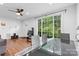Open-concept living and dining area with hardwood floors and large windows for natural light at 2536 Bancroft St, Charlotte, NC 28206
