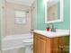 Bathroom features a single sink, white countertop and beige tiling at 2601 Marldale St, Gastonia, NC 28052