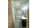 Bright bathroom features a shower over tub combination, tiled walls, and a modern vanity at 2601 Marldale St, Gastonia, NC 28052