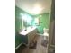 Bathroom with double vanity, storage, and gray rugs at 2601 Marldale St, Gastonia, NC 28052