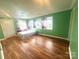 Bedroom with windows, bed and hard wood flooring at 2601 Marldale St, Gastonia, NC 28052