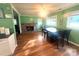 Dining room featuring stone fireplace and hardwood flooring at 2601 Marldale St, Gastonia, NC 28052
