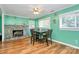 Cozy dining room with stone fireplace, hardwood floors, and ample natural light at 2601 Marldale St, Gastonia, NC 28052