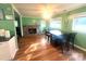Dining room featuring stone fireplace and hardwood flooring at 2601 Marldale St, Gastonia, NC 28052